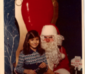 I was 6 yrs. old here. I told Santa I was a very good girl and asked him to bring me a puppy for Christmas. (I didn't get a puppy) - Sara S