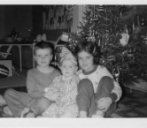 Christmas 1959 That's me in the center with my brother, Kent, and sister, Karen. Gotta love my get-up!!! - Kris Y
